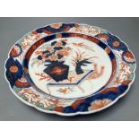 A 19th century Imari dish, painted in typical palette, 30.5cm diameterCONDITION: There is slight