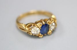 A late Victorian 18ct gold, sapphire and diamond three stone ring, size I/J, gross 3.2 grams.