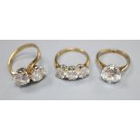 Three assorted 9ct and simulated diamond set dress rings, gross 10.3 grams, one possibly