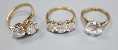 Three assorted 9ct and simulated diamond set dress rings, gross 10.3 grams, one possibly