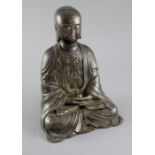 A Chinese bronze seated figure of the Bodhisattva Ti Tsang, 24.5cm high