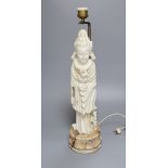 An alabaster carved figural lamp in the shape of Guanyin, overall height 54cm