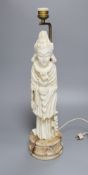 An alabaster carved figural lamp in the shape of Guanyin, overall height 54cm