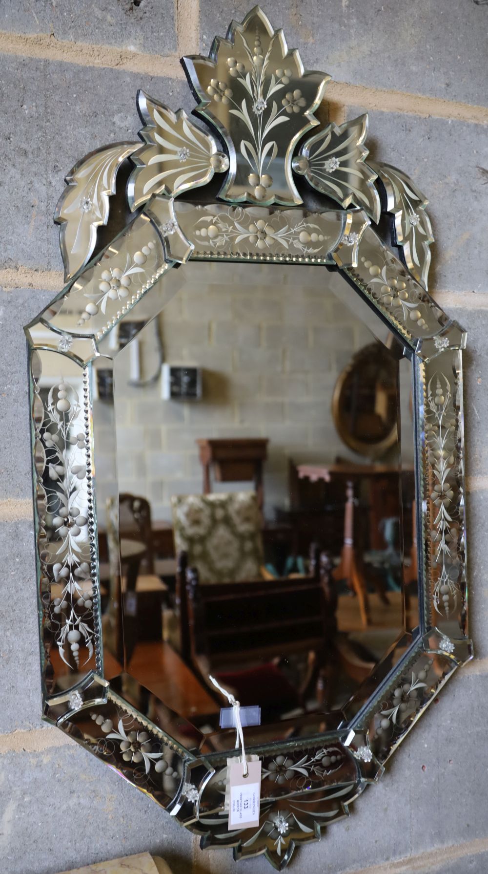 A Venetian glass wall mirror, width 50cm height 94cm