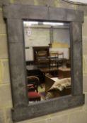 A rectangular pewter framed wall mirror, 64 x 110cm