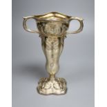 An Edwardian Art Nouveau repousse silver two handled vase, decorated with mother & child,