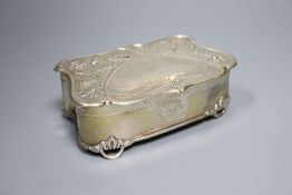 An Edwardian Art Nouveau silver trinket casket by Henry Matthews, with stylised floral decoration,