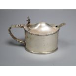 An Edwardian oval silver lidded mustard pot and matching spoon, Stokes & Ireland, Chester, 1905,