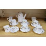 A Royal Paragon thorn patterned coffee set, coffee pot 15cm highCONDITION: One saucer broken, the
