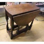 A small oak gateleg table, width 65cm, depth 34cm, height 66cm