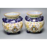 A pair of Urbino style Delft bulbous-bodied two-handled vases, each on three feet, height 18cm