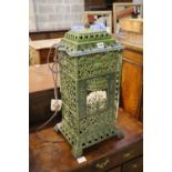 A French green enamelled cast iron heater, 60cm high