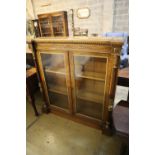 A Victorian parcel gilt walnut inverse breakfront bookcase, width 112cm, depth 27cm, height 118cm