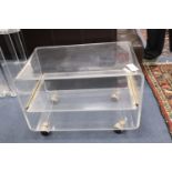 A 1970s lucite wheeled stand, width 65cm x depth 40cm, height 47cm