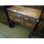 An early 18th century walnut lowboy, fitted four drawers, width 74cm, depth 44cm, height 71cm