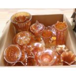 A quantity of orange carnival glass dishes, vases etc