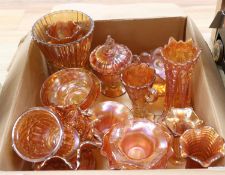 A quantity of orange carnival glass dishes, vases etc