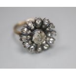 An antique yellow metal and diamond set circular cluster ring, (adapted?), size K/L, gross 3.5