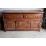 An 18th century style oak low dresser, width 168cm, depth 58cm, height 86cm