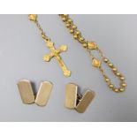 A pair of engine-turned 9ct gold oval cufflinks, 3.9 grams and a yellow metal rosary (tests as
