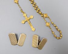 A pair of engine-turned 9ct gold oval cufflinks, 3.9 grams and a yellow metal rosary (tests as