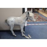 A reconstituted garden ornament of a foal, height 73cm