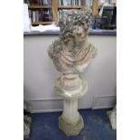 A reconstituted stone bust on pedestal, height 162cm