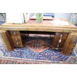 A French Art Deco rosewood desk in the manner of Paul Follot Height 74cm, width 185cm, depth 108cm.