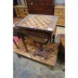 A Victorian rosewood topped games / work table, width 44cm, depth 33cm, height 73cm