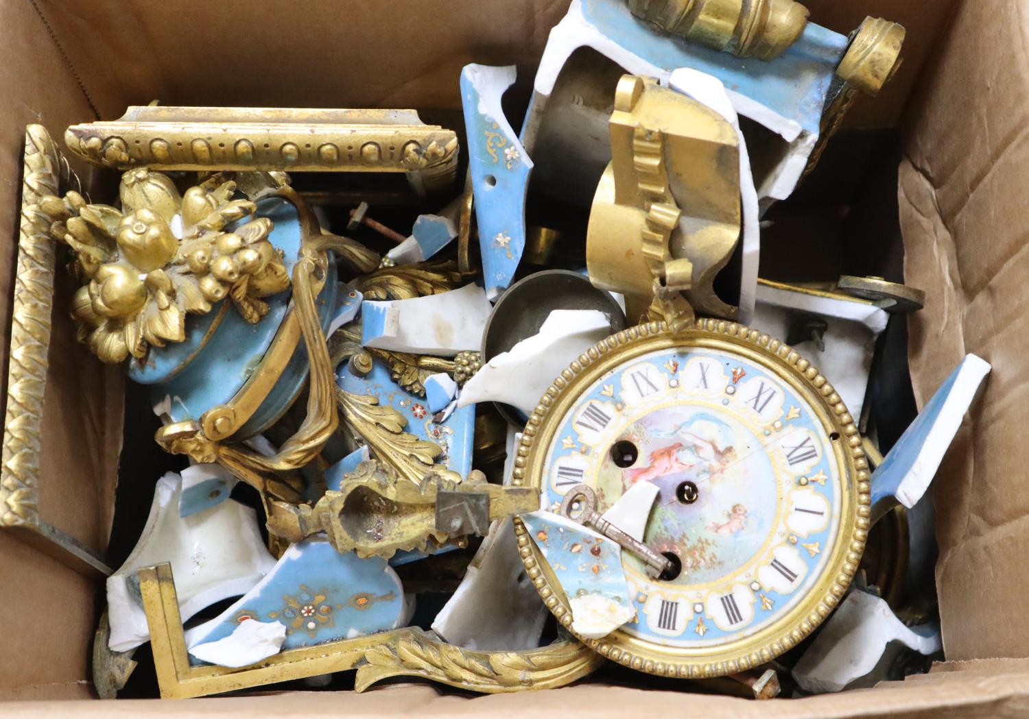 A French porcelain and ormolu clock (for restoration)