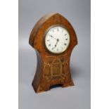 An Art Nouveau inlaid oak mantel clock, convex dial and French movement, case inlaid with copper