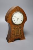 An Art Nouveau inlaid oak mantel clock, convex dial and French movement, case inlaid with copper