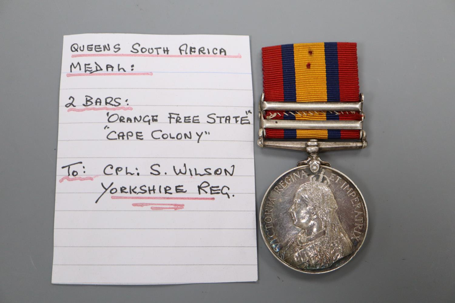 A Queen's South Africa medal with 2 clasps to Cpl. S.Wilson, Yorks Regt. with OFS & CC clasps.