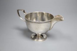 A George V silver pedestal cream jug, Walker & Hall, Sheffield, 1930, 85mm, gross 130 grams.