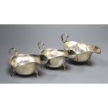 A pair of George V silver sauceboats, Barker Brothers, Chester, 1925 and one other earlier
