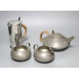 A Liberty's Tudric four piece pewter tea set, shape no.0231 - the jug shape no.0281, 19cm