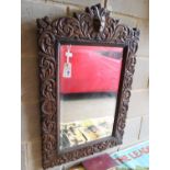 A late Victorian carved oak mirror, 60 x 90cm together with a late Victorian carved oak rope-twist