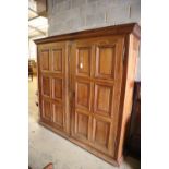 A 19th century French walnut two door panelled armoire, width 224cm, depth 58cm, height 222cm