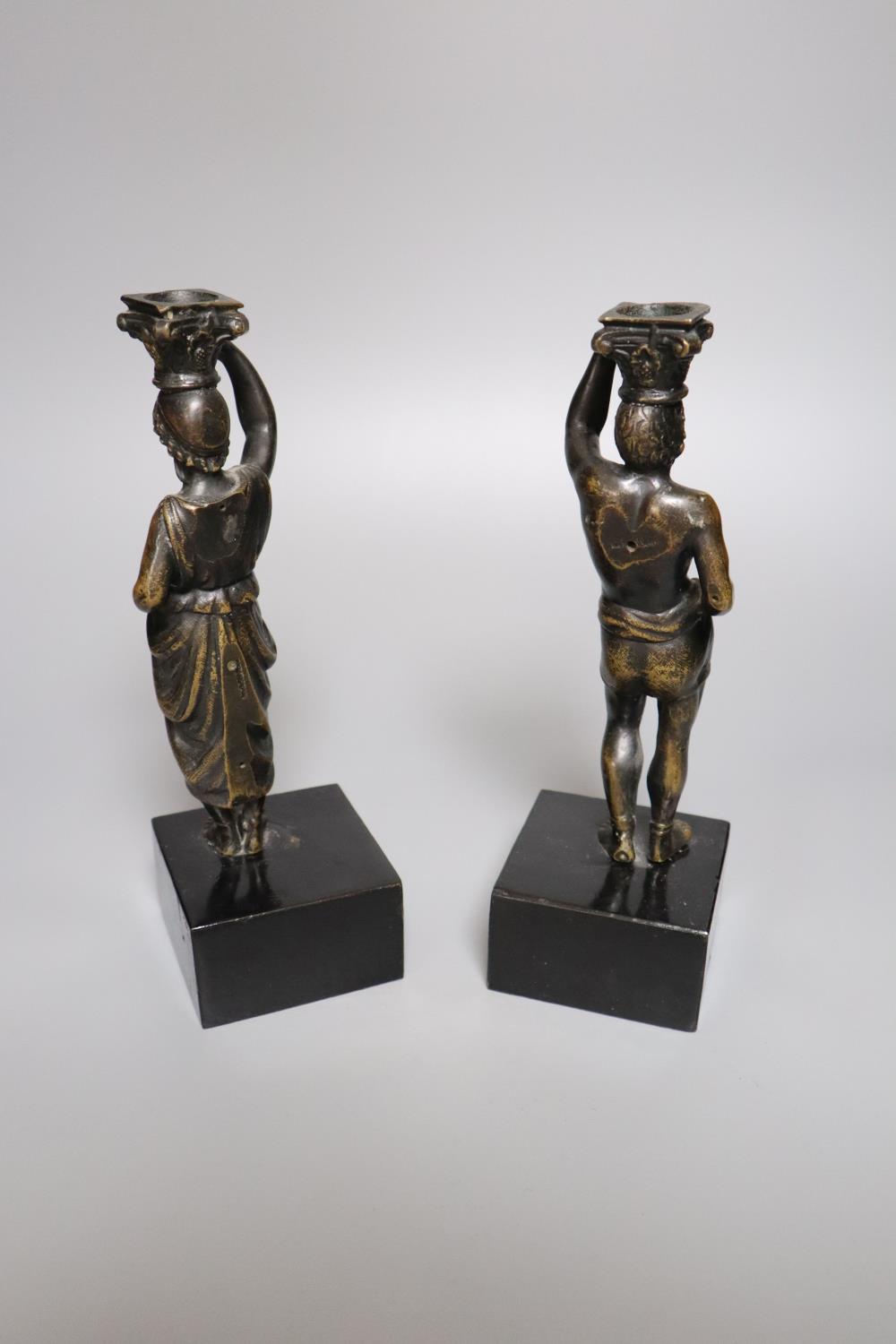 A pair of 19th century bronze figural candlesticks (once part of a clock), indistinctly stamped to - Image 2 of 3