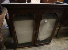 An early 18th century walnut bookcase top, width 100cm height 99cmCONDITION: Right hand glass has