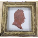 A framed wax profile of a gentleman, second quarter 19th century frame 33cm square