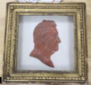 A framed wax profile of a gentleman, second quarter 19th century frame 33cm square