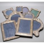 Nine assorted modern silver mounted photograph frames, largest 24.3cm.