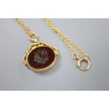 A late Victorian 18ct gold, carnelian and bloodstone set spinning fob seal, on a 15ct chain, seal
