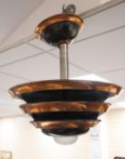 An Art Deco-style copper ceiling light