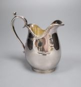 A George V Asprey & Co Ltd silver milk jug, London, 1915, 12.6cm, 5.5oz.CONDITION: Minor surface