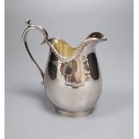 A George V Asprey & Co Ltd silver milk jug, London, 1915, 12.6cm, 5.5oz.CONDITION: Minor surface