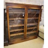 A Georgian style mahogany bookcase fitted a pair of astragal-glazed doors on plinth base, width