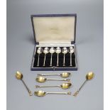 A set of six 1970's silver gilt 'fox head' terminal coffee spoons, 77 grams and a plated set of