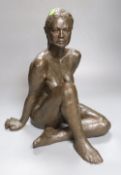 M. Pike. A bronzed terracotta figure of a seated nude female, height 38cm